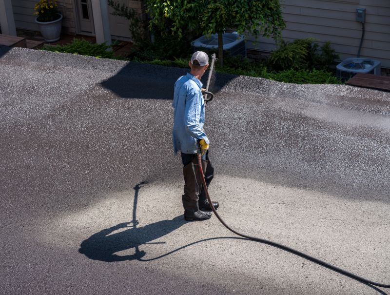 Applying Sealant on Residential Driveway